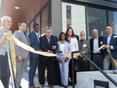 Those on hand for the Restoring Waters ribbon-cutting on Tuesday, May 14, 2024, included, from left, Housing Commissioner Jennifer Leimaile Ho, County Commissioner Rafael Ortega, Mayor Melvin Carter, Project for Pride in Living CEO Paul Williams, and Council Member Saura Jost and Ryan Companies' Tony Barranco, far right. Credit: Aaron Nesheim | Sahan Journal