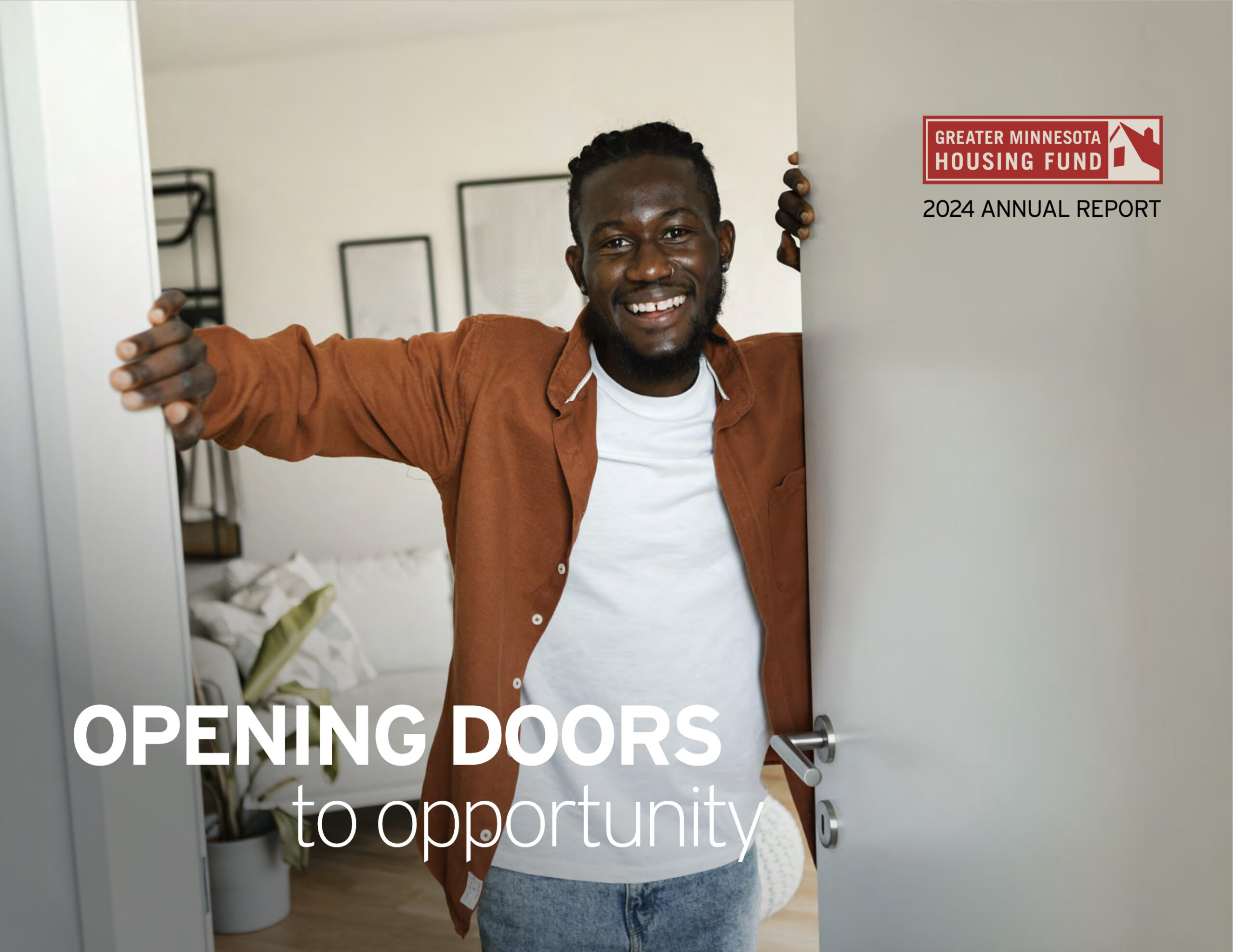 Cover of the Greater Minnesota Housing Fund 2024 Annual Report with a photo of a man opening the door to his home
