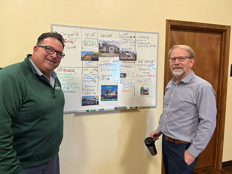 Rob Aitken, executive director of Leech Lake Financial Services, and Larry Refsland, manager of its residential development program, keep track of the organization's portfolio of home construction and renovation projects. The community development financial institution on the Leech Lake Reservation stepped in housing development after construction plunged in the region.
