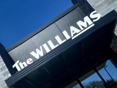 Signage about the door at The Williams, a new affordable housing development on the east side of Saint Paul