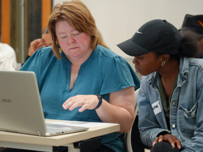 Two women looking at computer