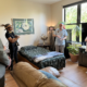 Marty, a resident of Clare Housing, gives a tour of his new apartment during the grand opening event