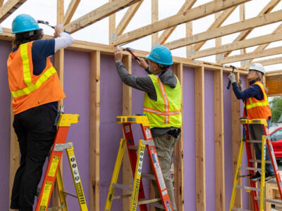 Fairview executive leaders and team members actively building homes with Habitat for Humanity