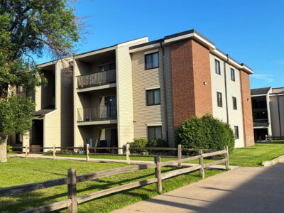 Exterior of Plymouth Colony, a three story apartment building