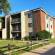 Exterior of Plymouth Colony, a three story apartment building