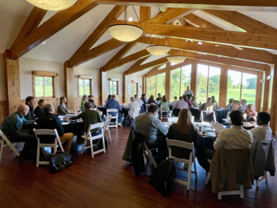 A roomful of partners listen to Peter Ebnet at the GMHF Energy Convening